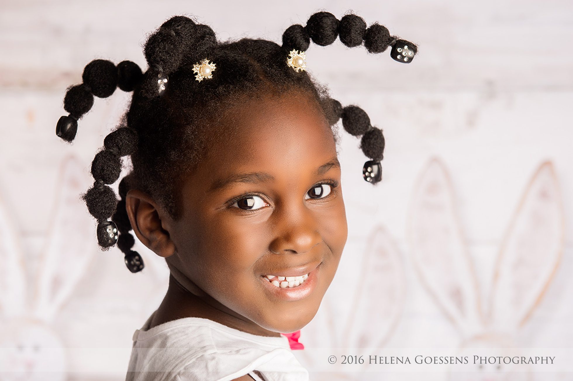 African american girl with braids smiling to the camera