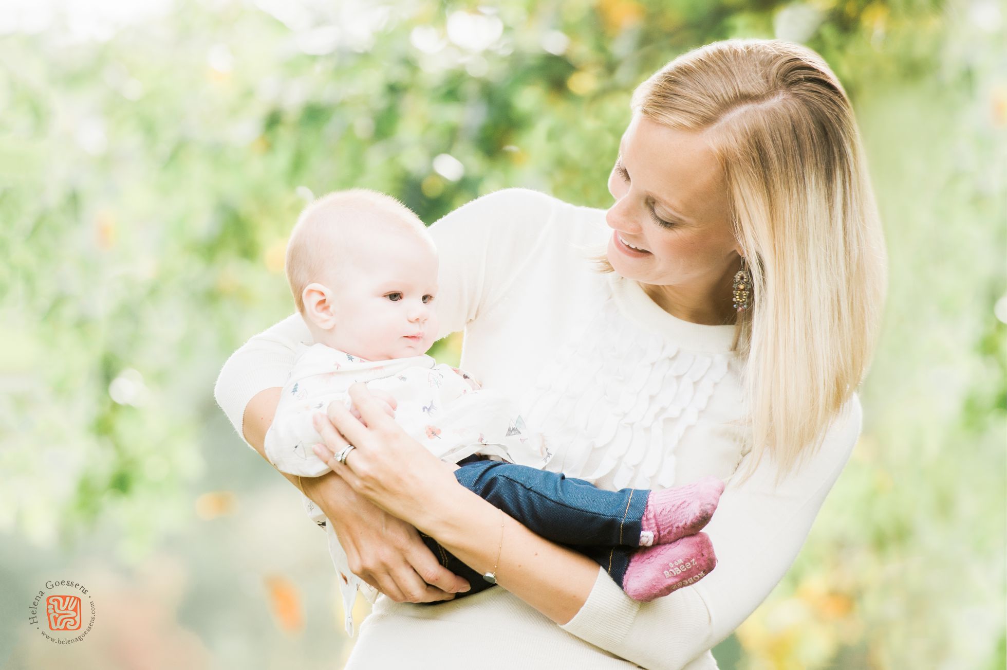 blond woman and a baby wearing a cream sweater