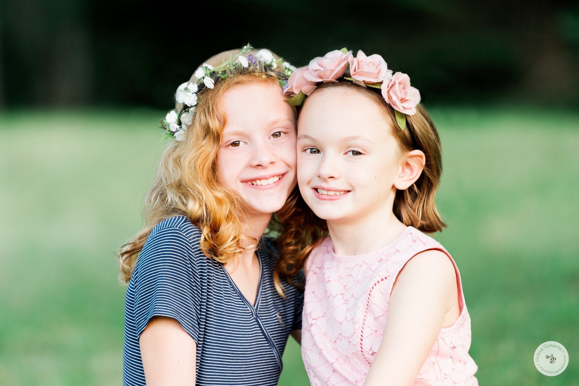 close up of two girls wearing flower headbands