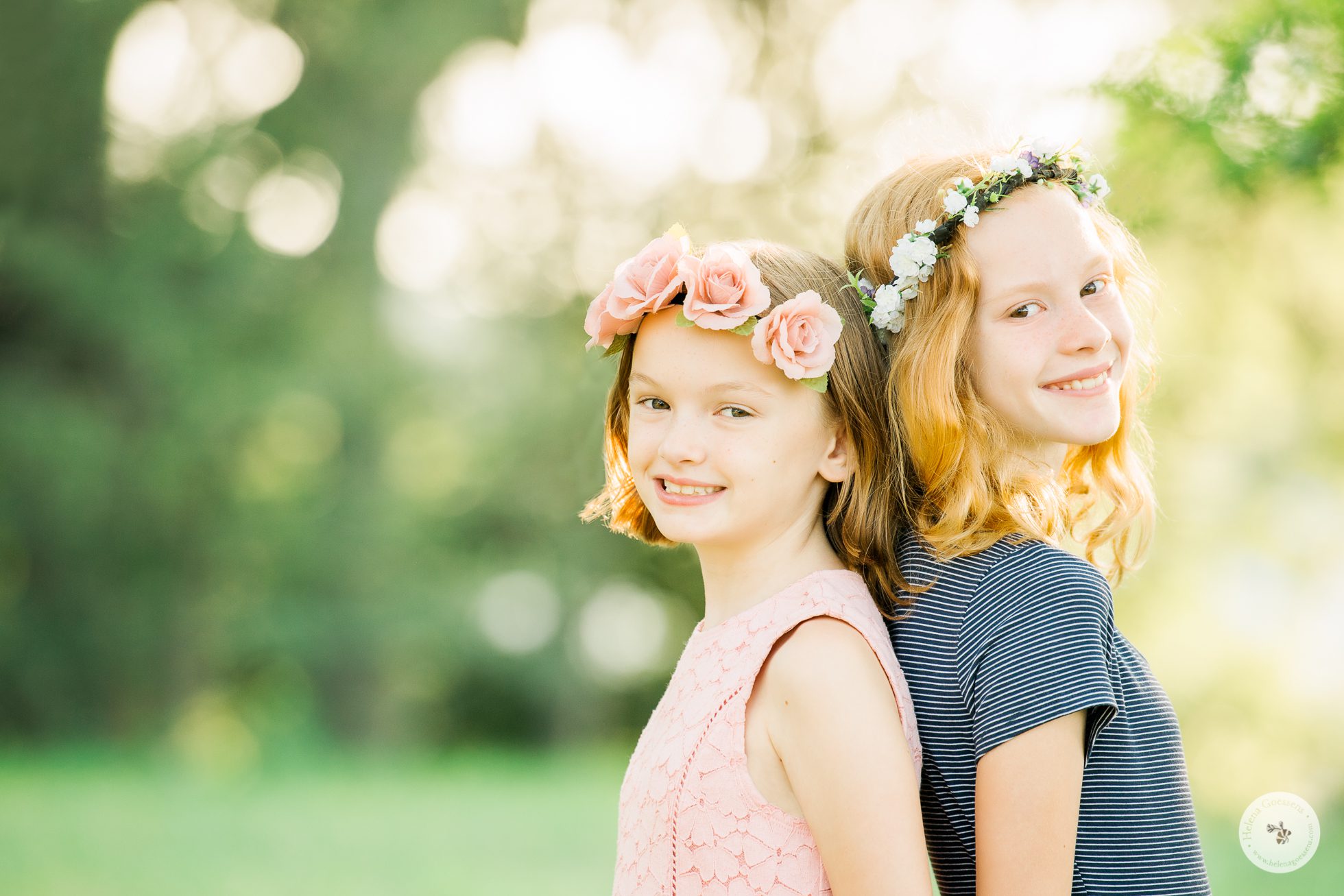 Family Summer Session portrait of two girls wearing a flower headband.