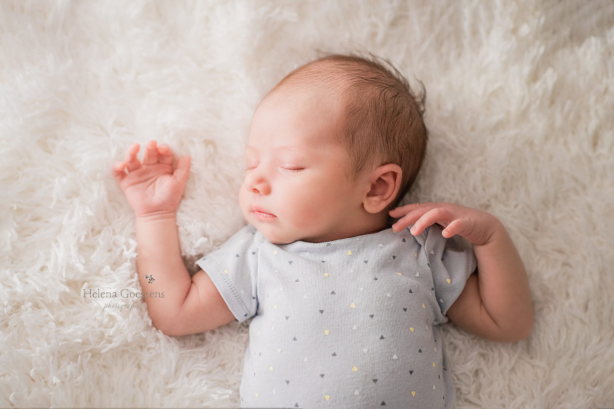 baby boy sleeps during lifestyle newborn session with Helena Goessens
