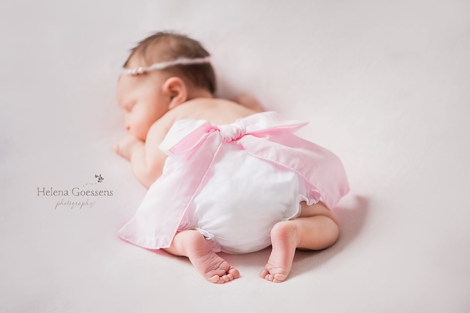 baby girl during in home lifestyle newborn session with Helena Goessens Photography