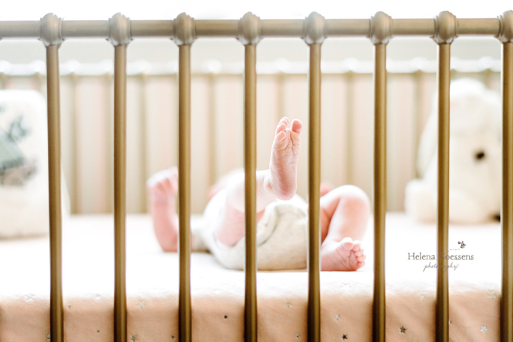 Helena Goessens Photography captures newborn baby in crib