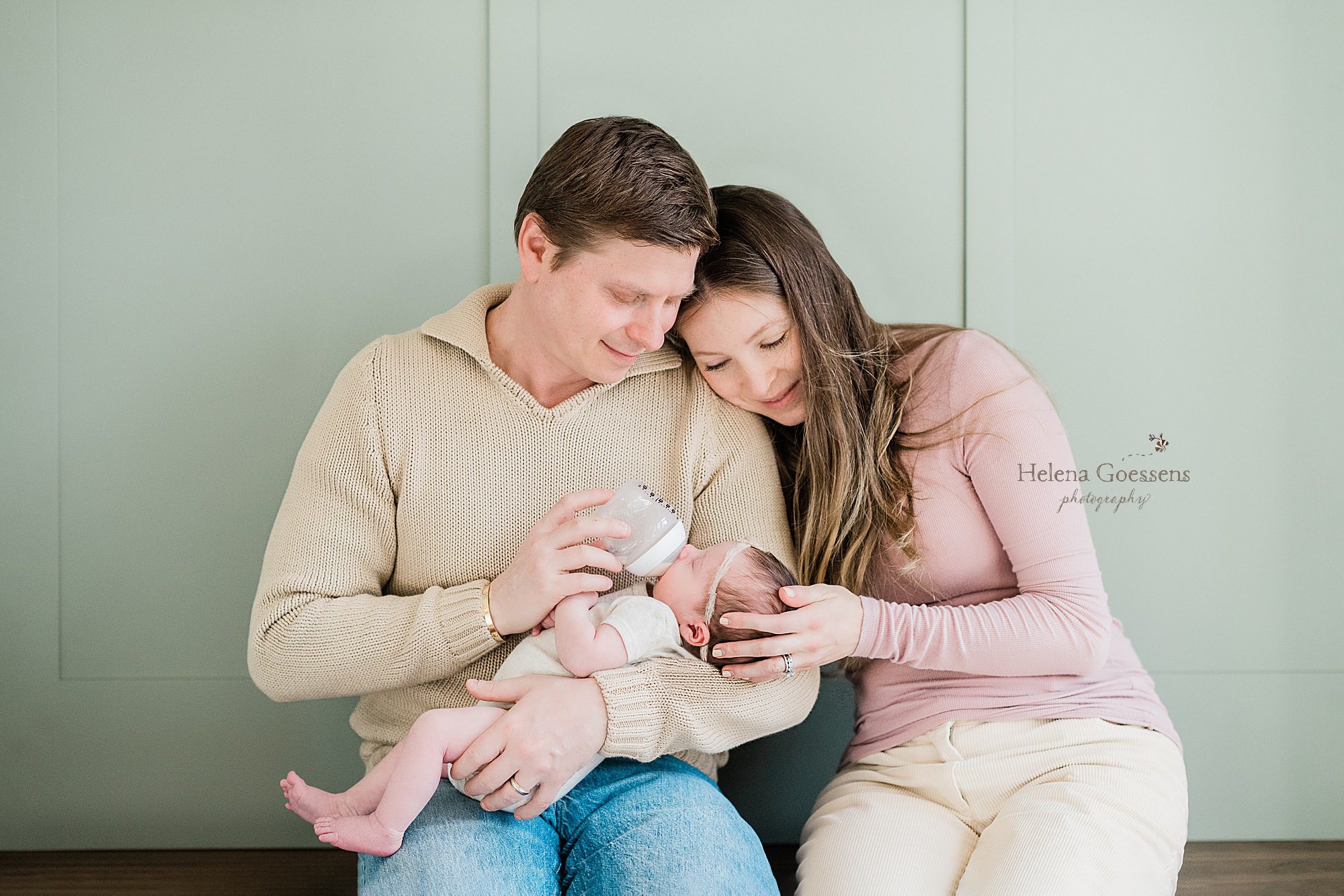 new family cuddles during newborn lifestyle session with Helena Goessens Photography