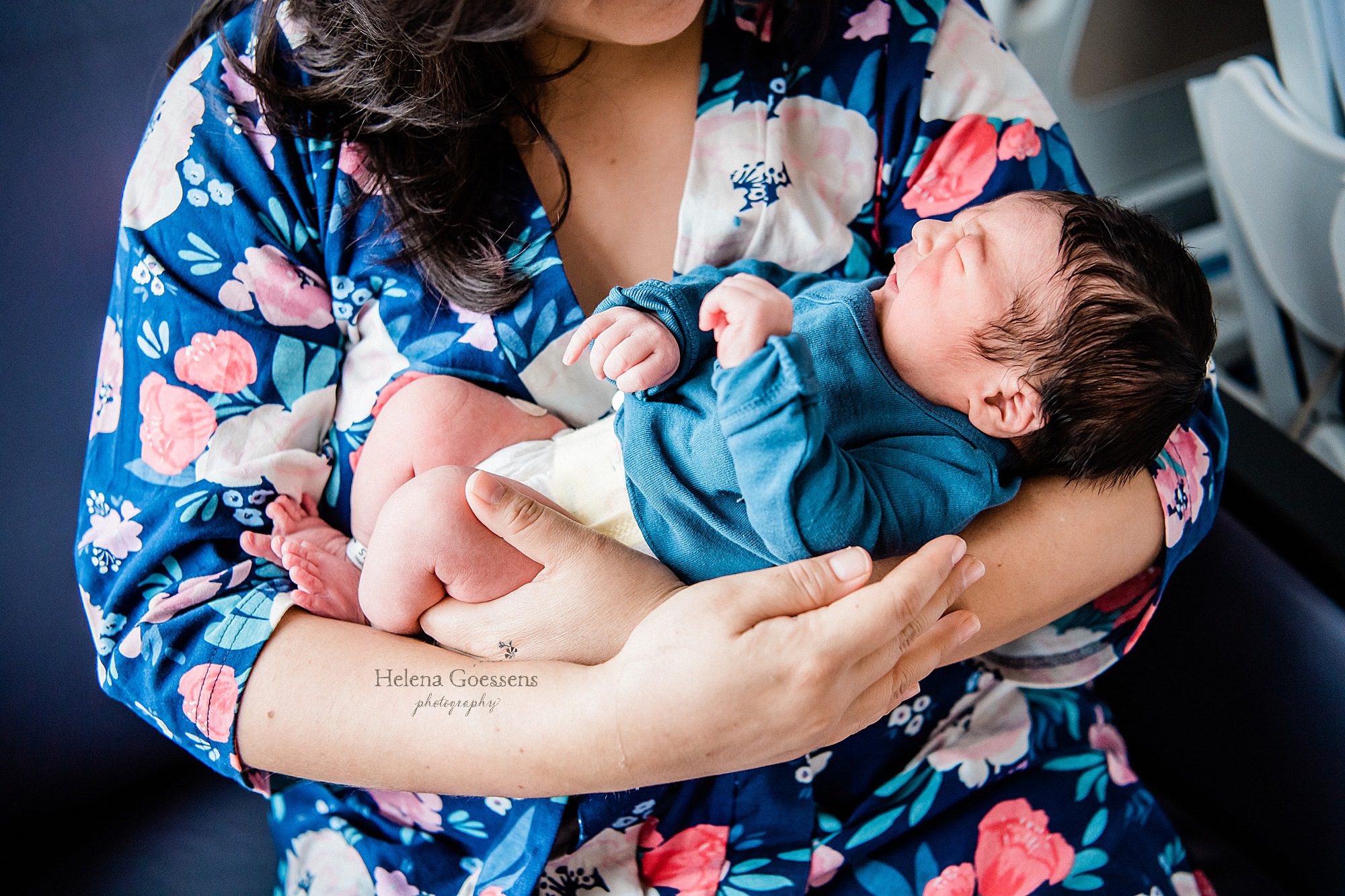 new mom holds baby boy during Fresh 48 session with Boston newborn photographer Helena Goessens Photography