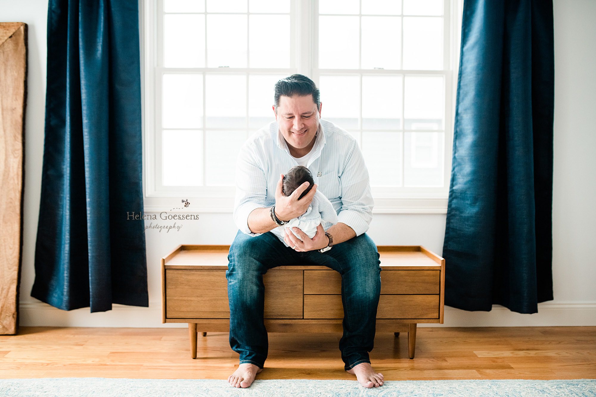 father holds baby boy photographed by Boston newborn photographer Helena Goessens Photography