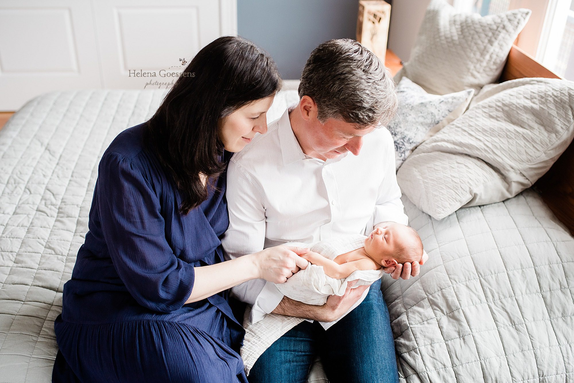 new parents snuggle with baby during lifestyle session with Helena Goessens Photography