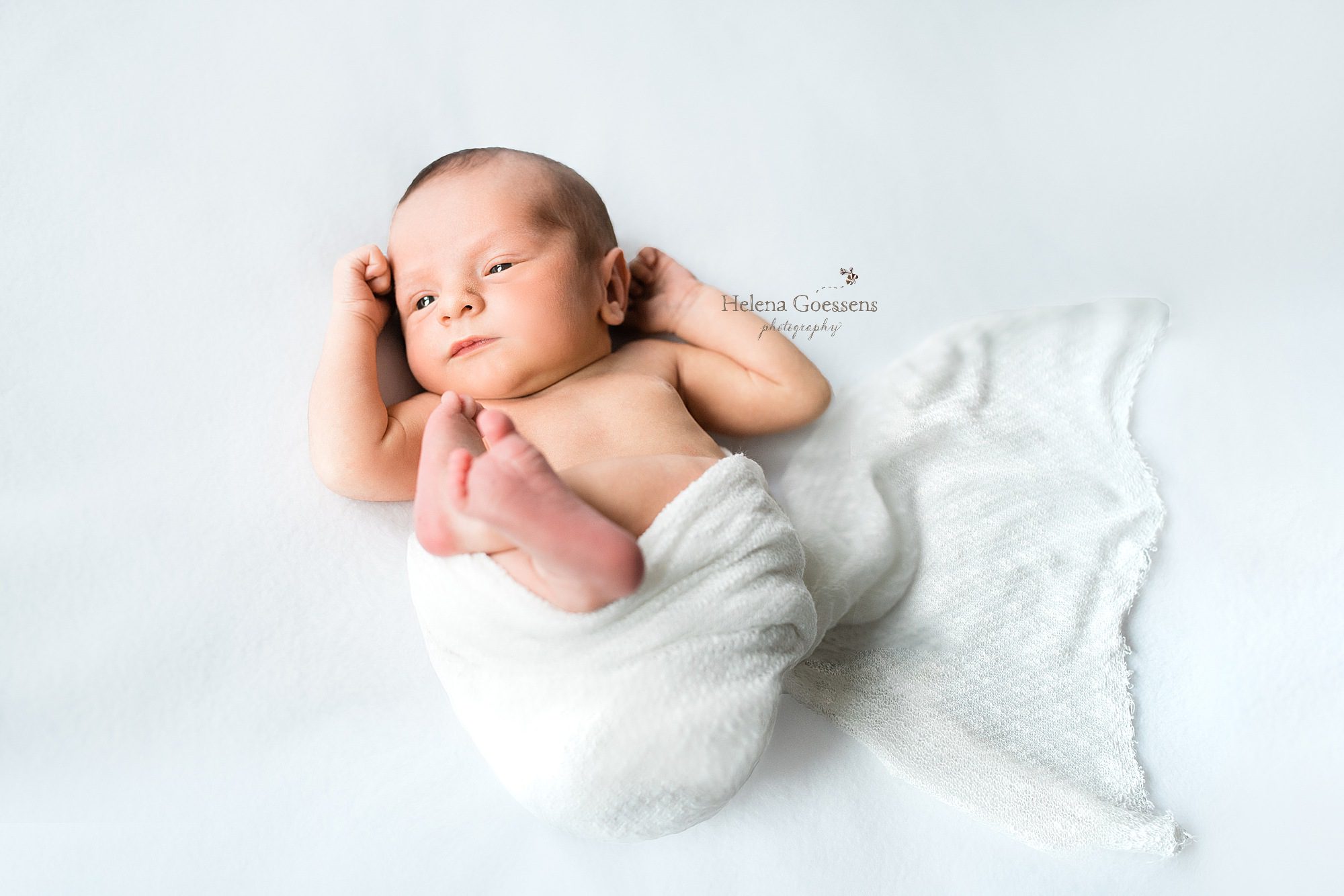 baby boy during lifestyle newborn session with Helena Goessens Photography