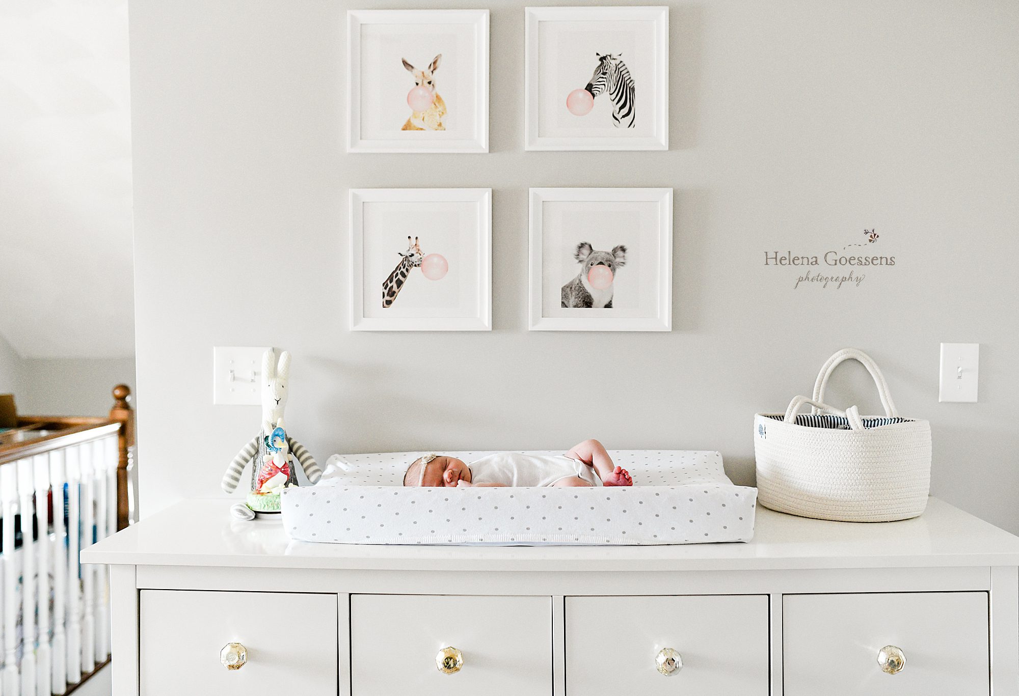 baby girl in nursery for newborn portraits by Helena Goessens Photography
