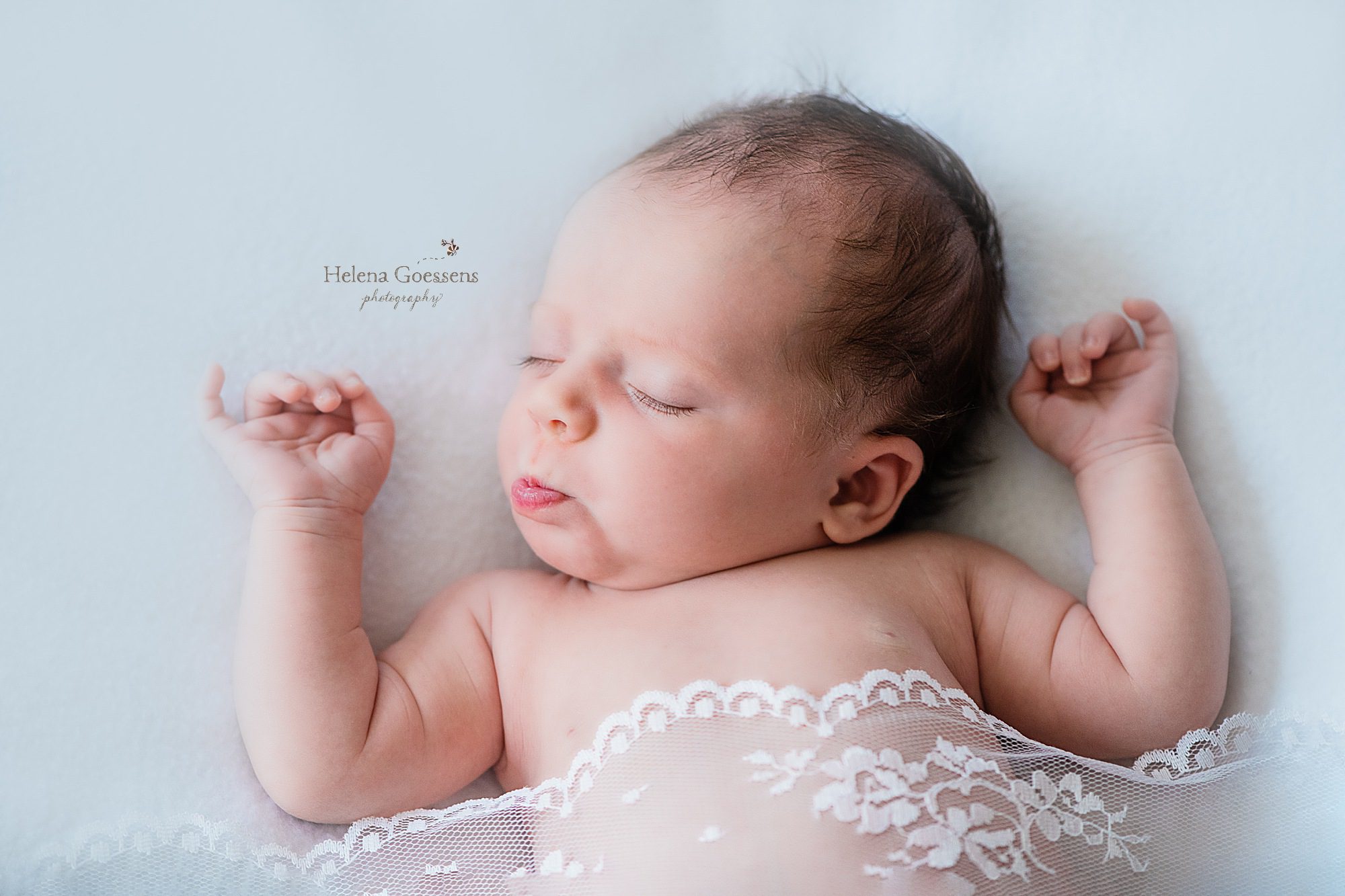baby girl in lace photographed by Helena Goessens Photography