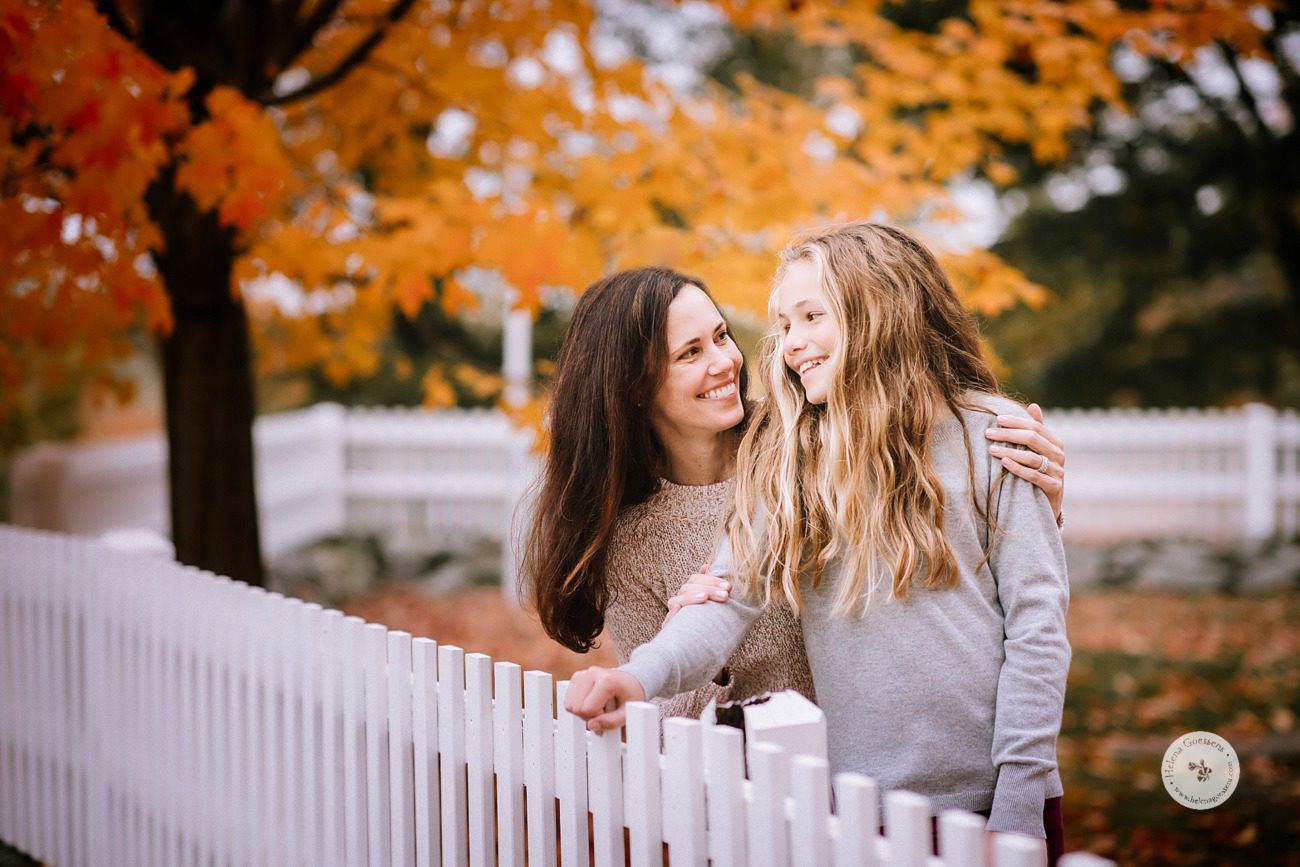 mom and daughter laugh during family photos in Dedham MA with Helena Goessens Photography