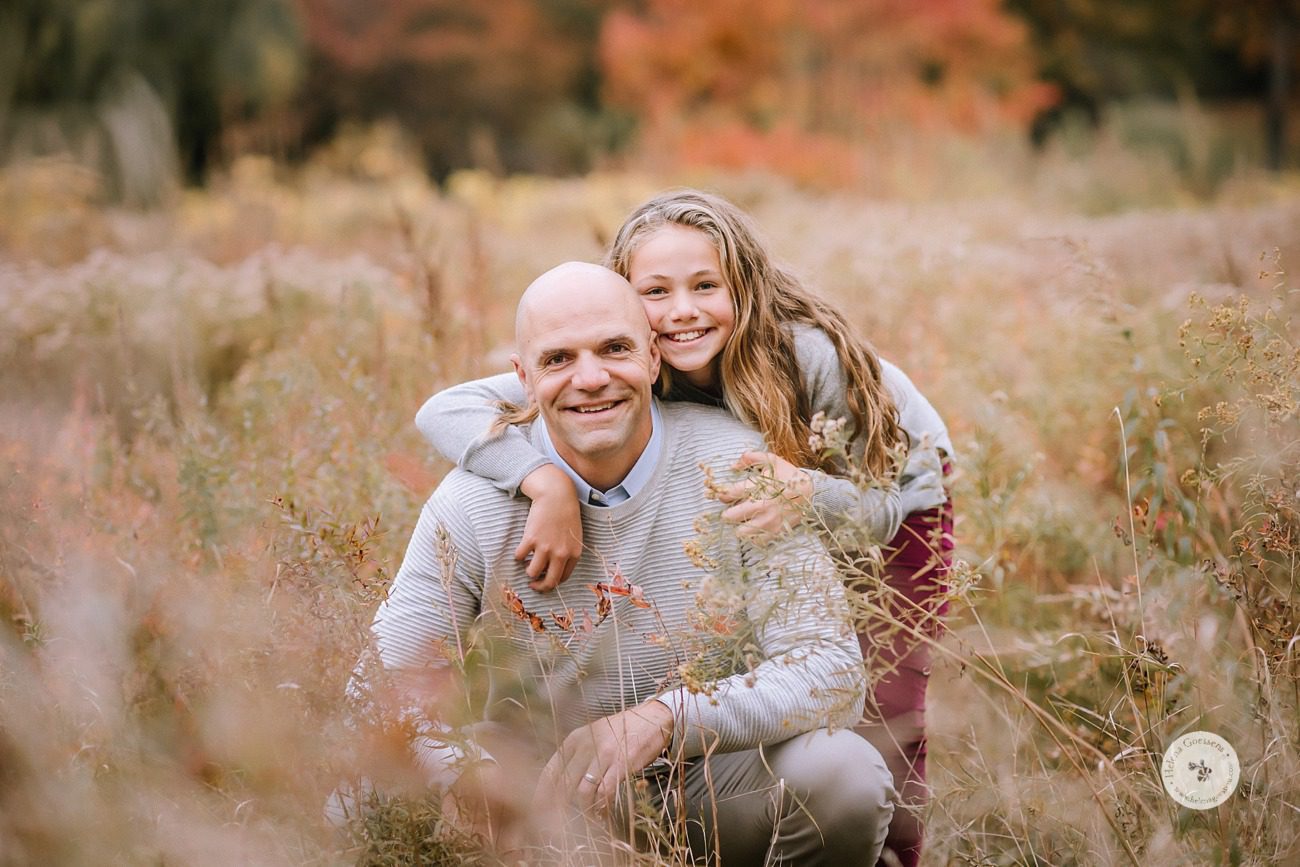 dad and daughter pose during family photos with Helena Goessens Photography