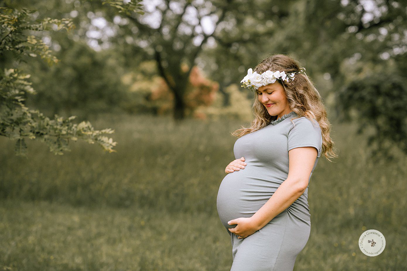 maternity portraits with mom in grey dress with floral crown in Arnold' Arboretum with Helena Goessens Photography