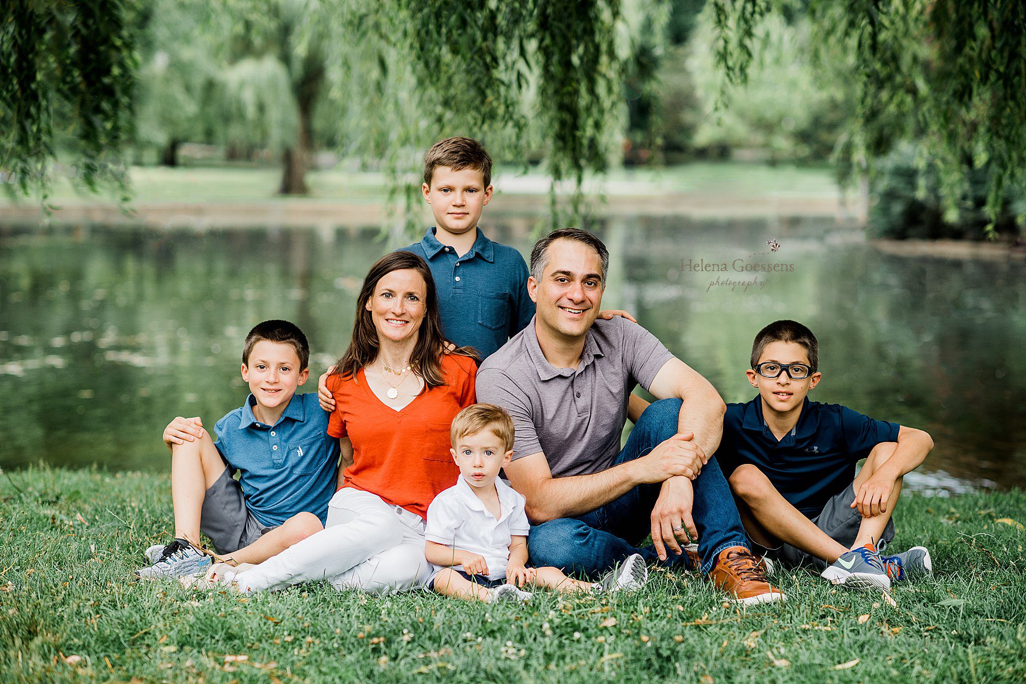 parents pose with four boys in Boston Public Garden photographed by Helena Goessens Photography