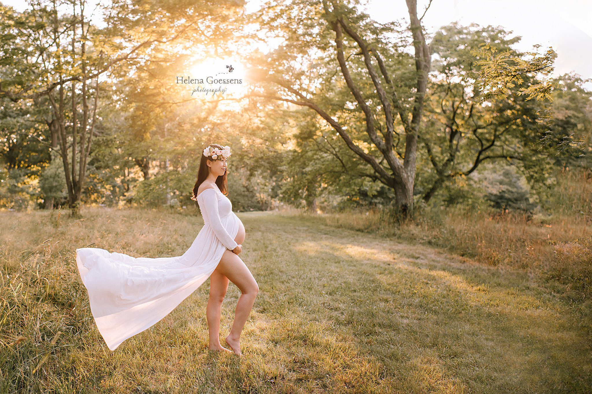 mom shows off belly during maternity session in Jamaica Plain with Helena Goessens Photography