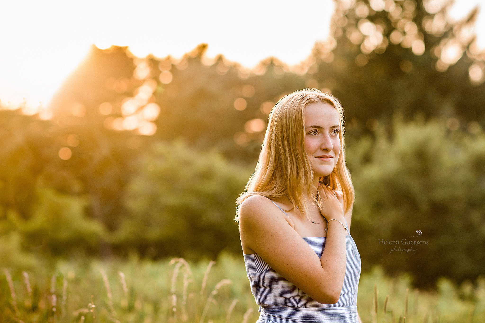 sunset portrait of college student at Arnold Arboretum family session