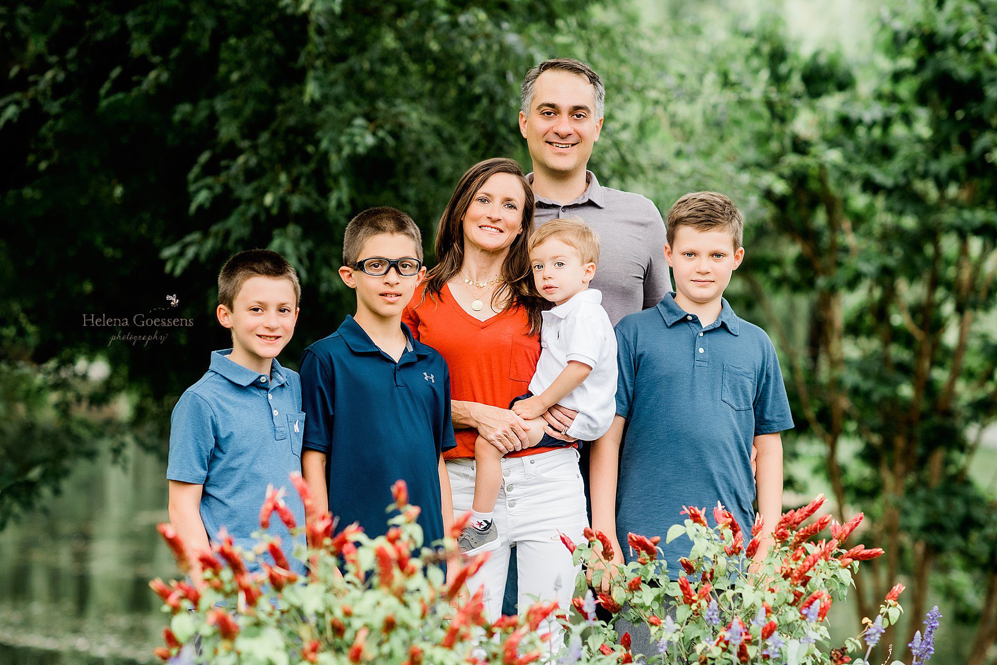 parents pose with four sons in gardens in Boston with Helena Goessens Photography