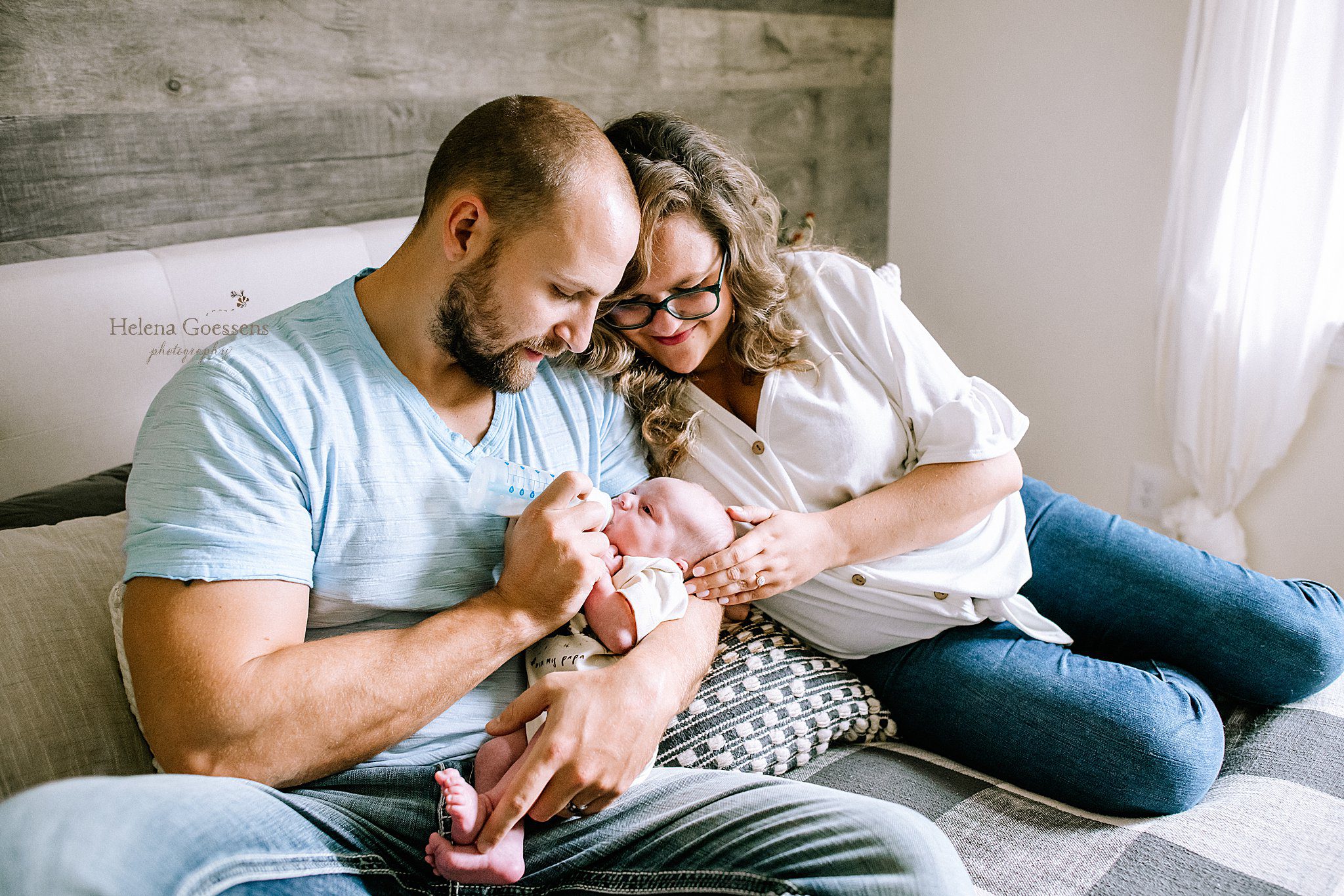 parents cuddle and feed new baby boy during Dedham MA Lifestyle Newborn Session