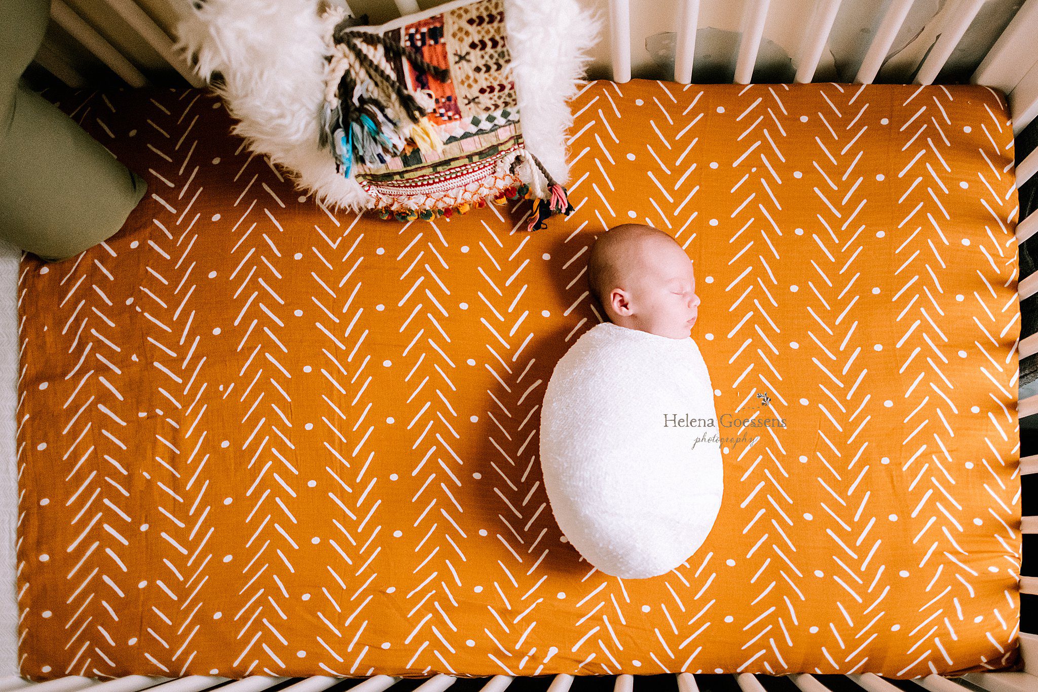 baby sleeps on orange sheets during Dedham MA Lifestyle Newborn Session