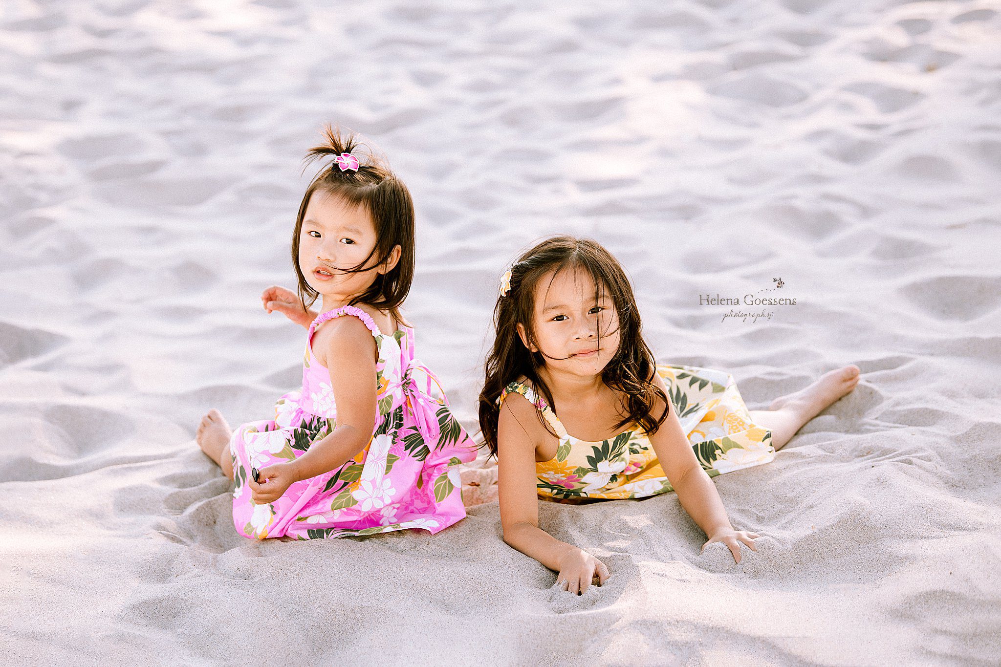 sisters play in the sand at Rexhame Beach Family Portraits