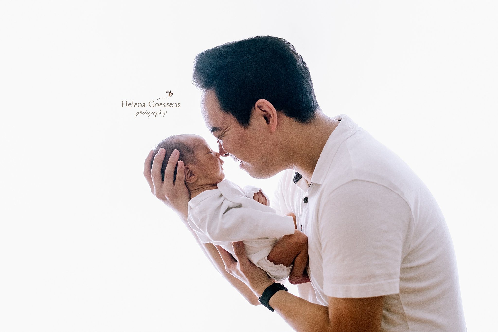 dad kisses son during Chestnut Hill lifestyle newborn session