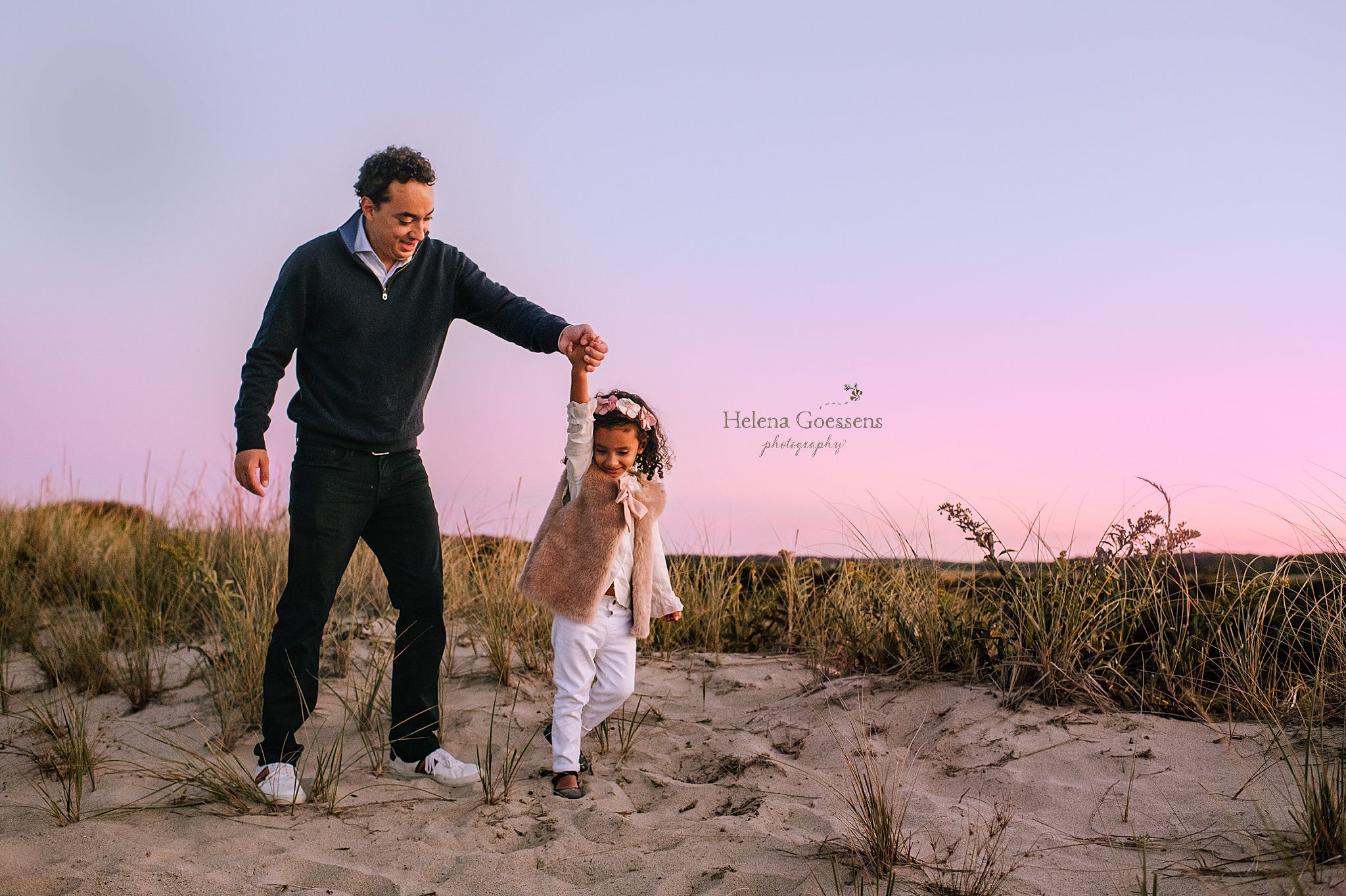 dad and daughter walk on sand during Rexhame Beach family photos