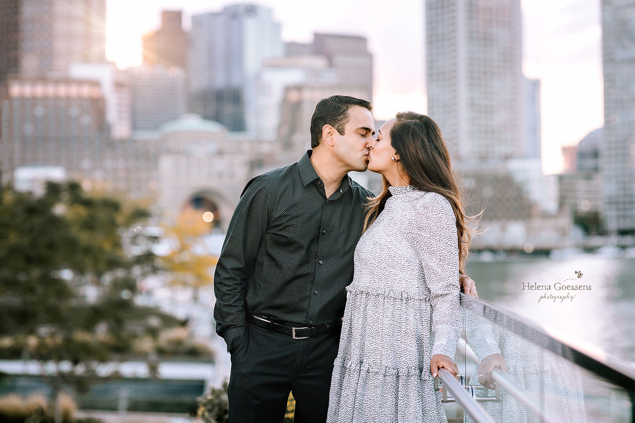 husband and wife kiss at Fan Pier Park photographed by Helena Goessens Photography