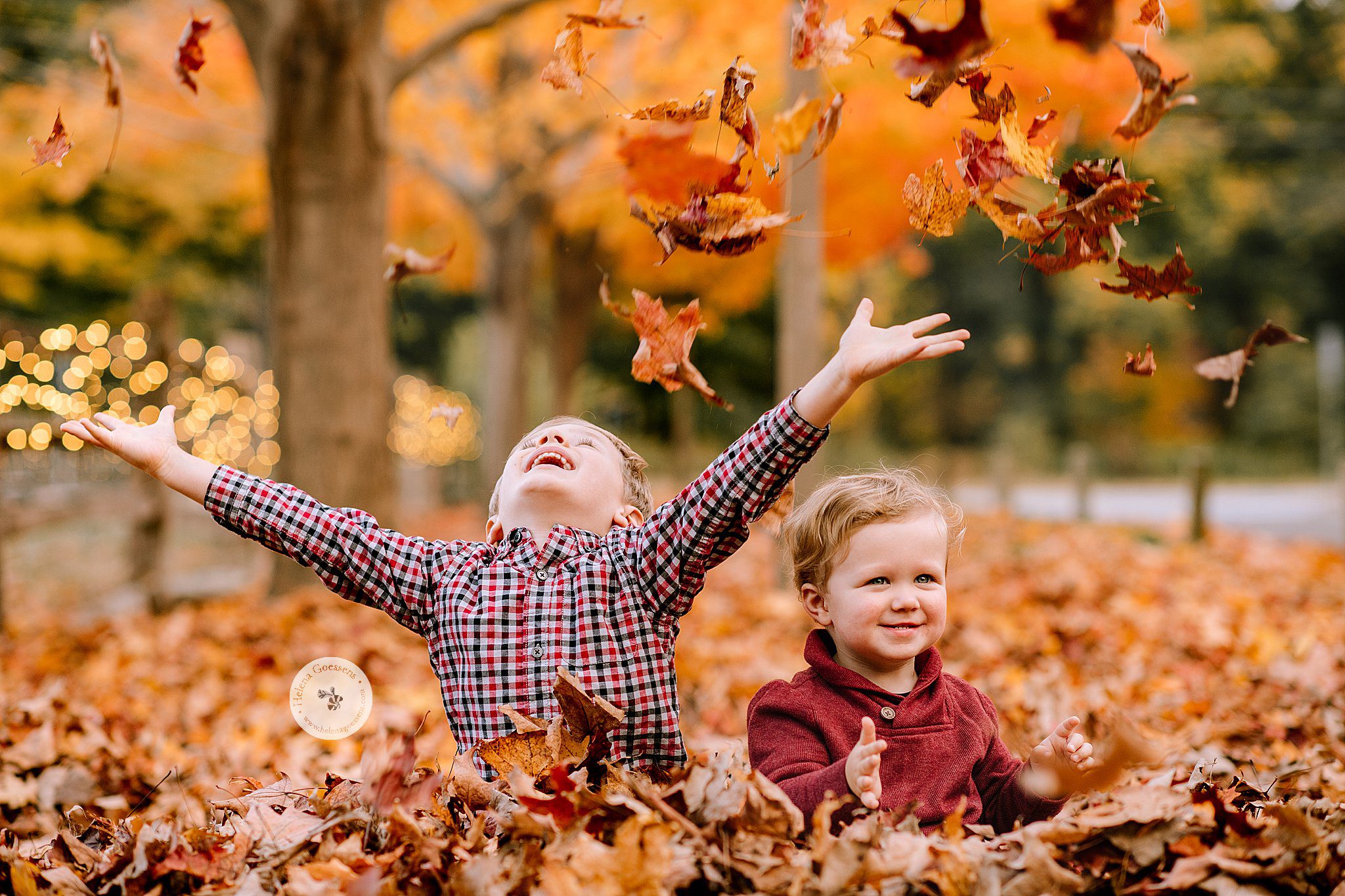 kids throw leaves at Bradley Estate during Canton MA Family Portraits