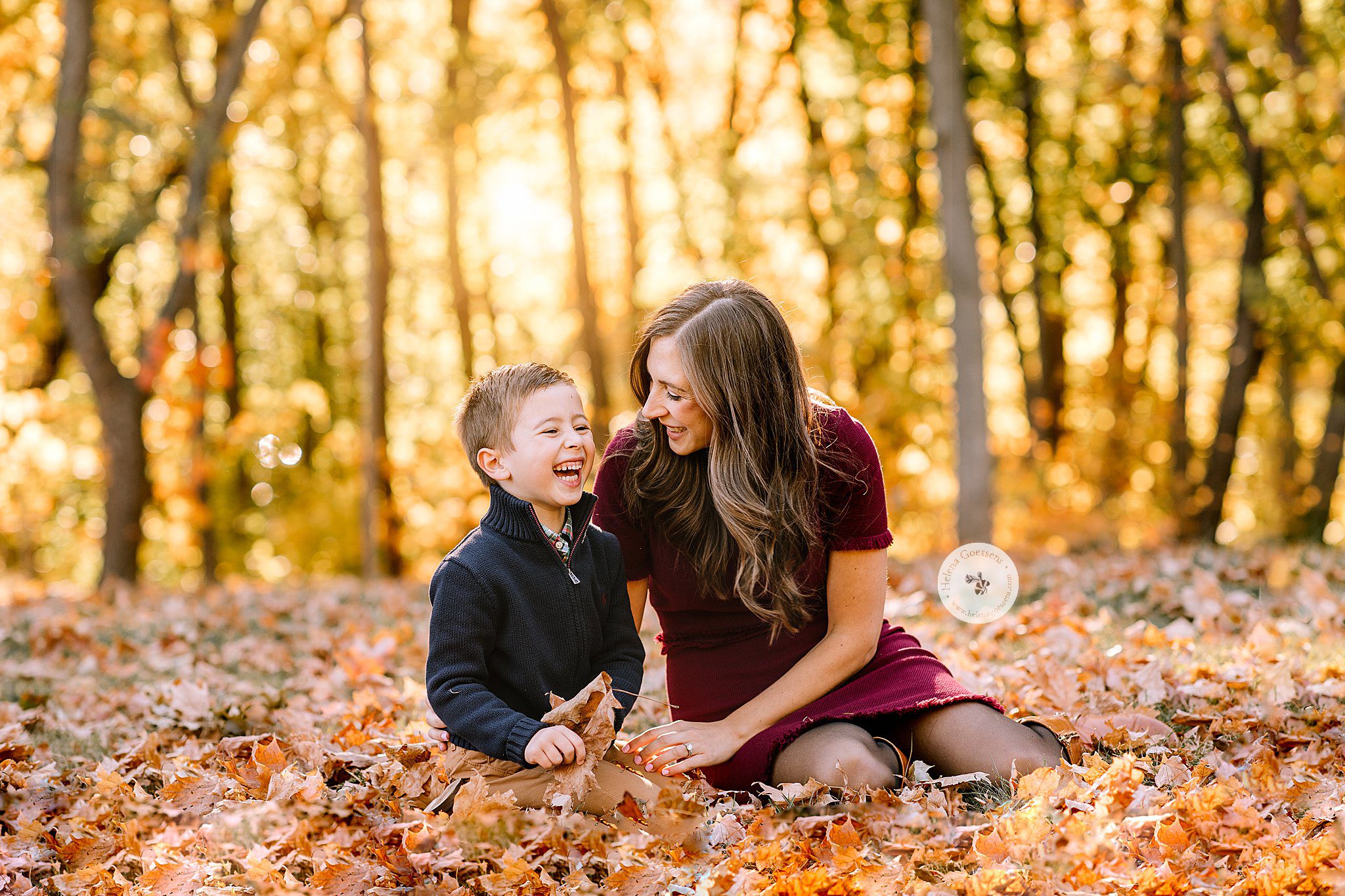 Helena Goessens Photography photographs mom and son laughing in leaves at Larz Anderson Park