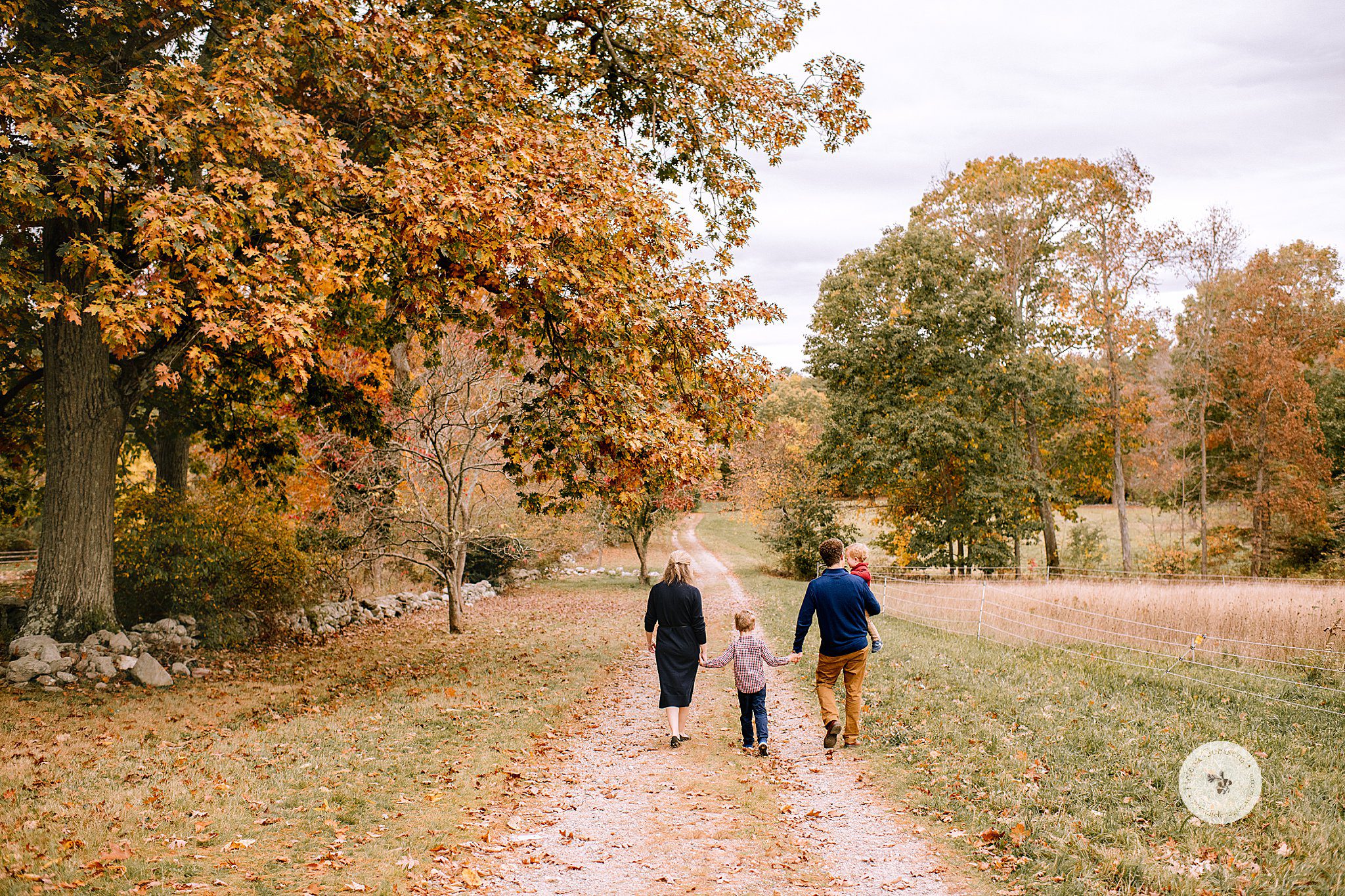 Helena Goessens Photography captures family of four walking on path at Bradley Estate