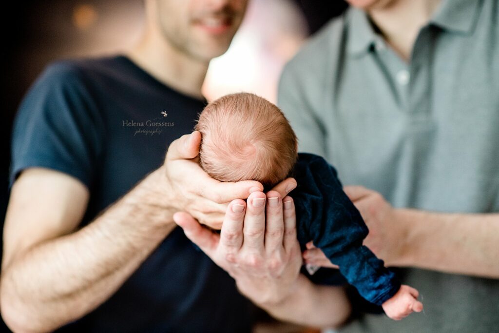 Helena Goessens Photography photographs dad's holding baby boy's head
