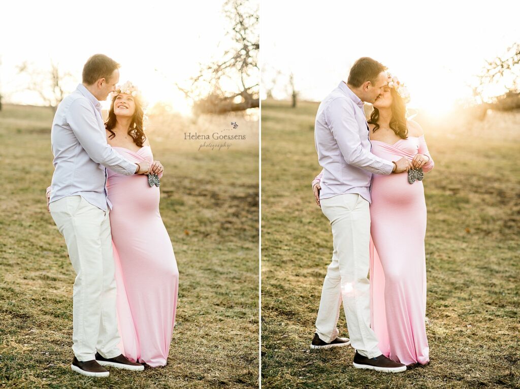 Expecting couple holding baby shoes photographed by Helena Goessens Photography