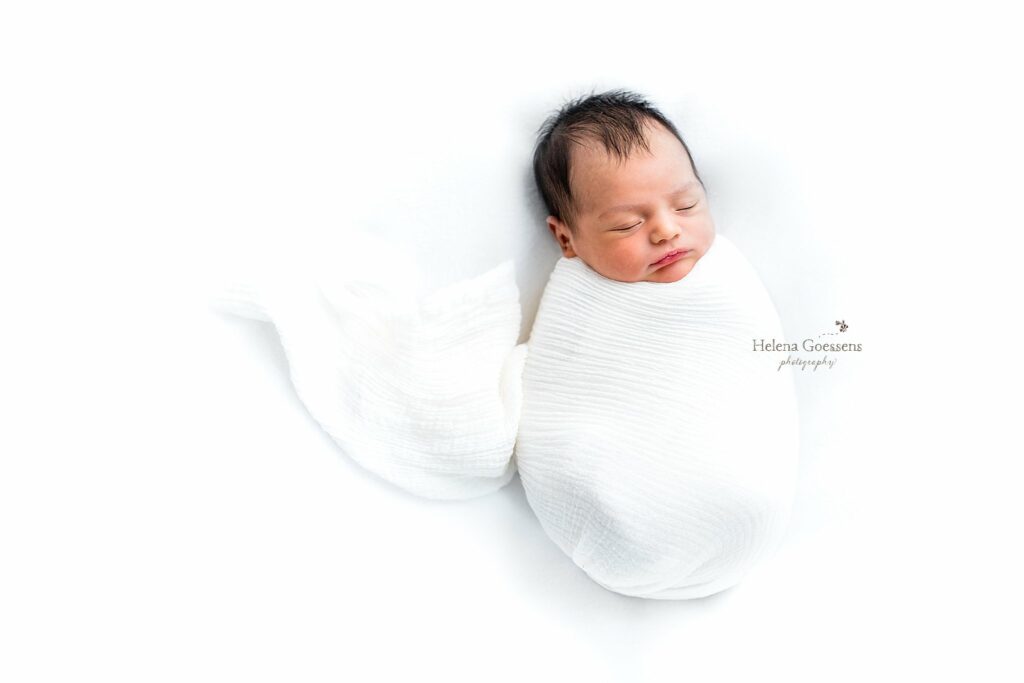 baby sleeps in white wrap during Jamaica Plains lifestyle newborn session 