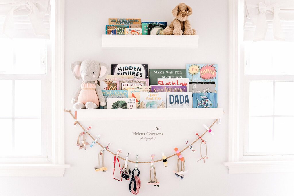 book display for baby girl in nursery at home