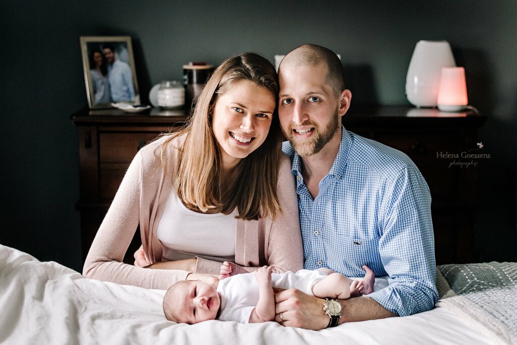parents pose with daughter during Lifestyle Newborn Session in Quincy MA