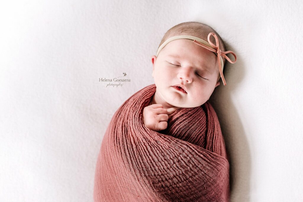 Lifestyle Newborn Session in Quincy MA for baby girl sleeping in rose wrap