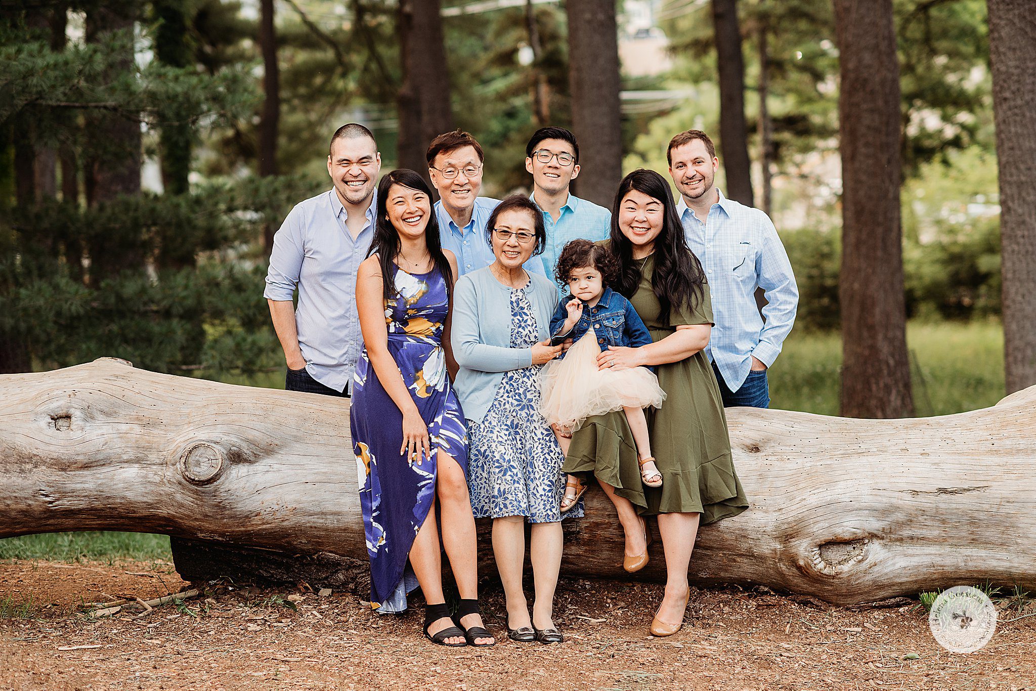 Peter’s Hill family reunion with family posing against fallen tree