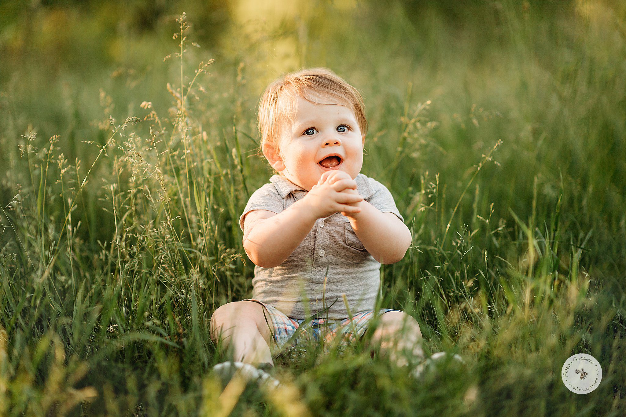 toddler plays in grass during family photos at Peter’s Hill