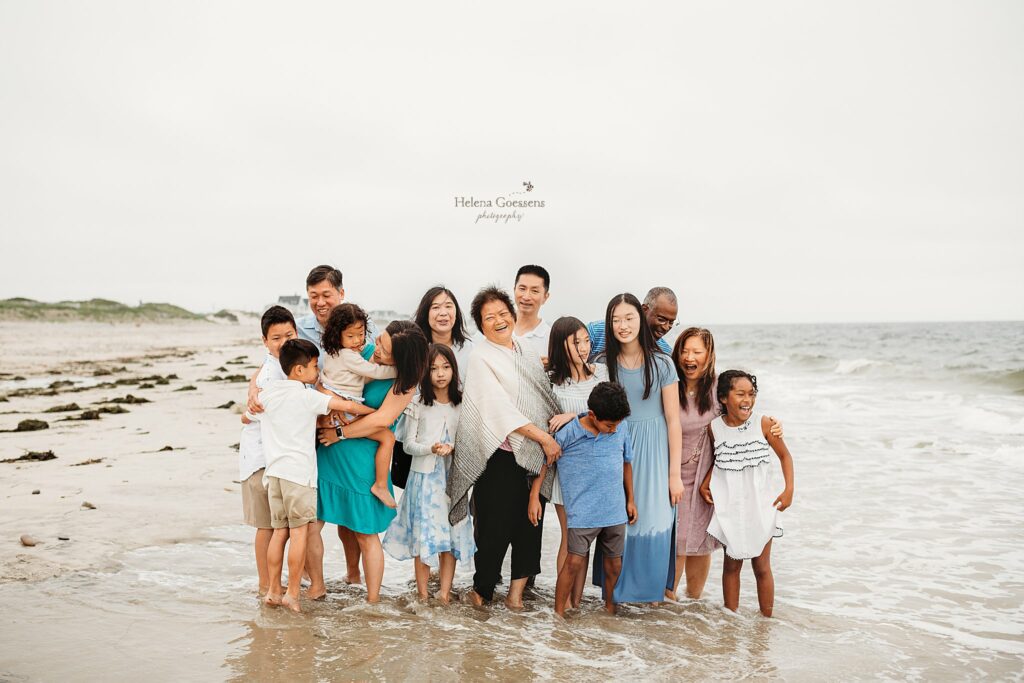 Extended Family Portraits of family in the water at Rexhame Beach 