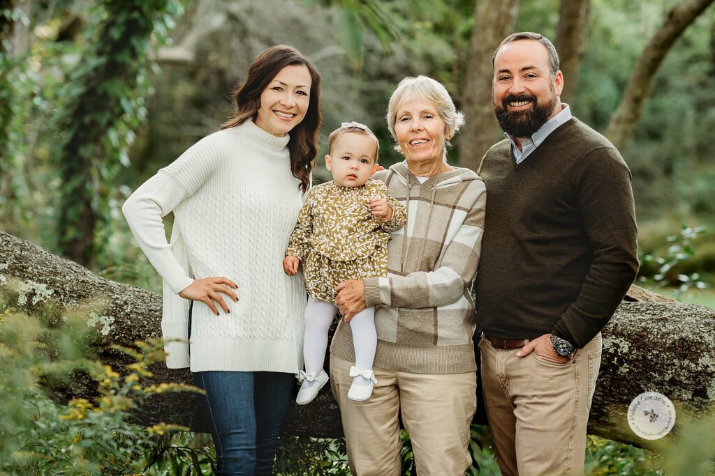 parents pose with toddler and grandmother during Larz Anderson Park family portraits 