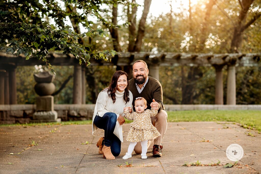 parents pose with daughter during Larz Anderson Park family photos 