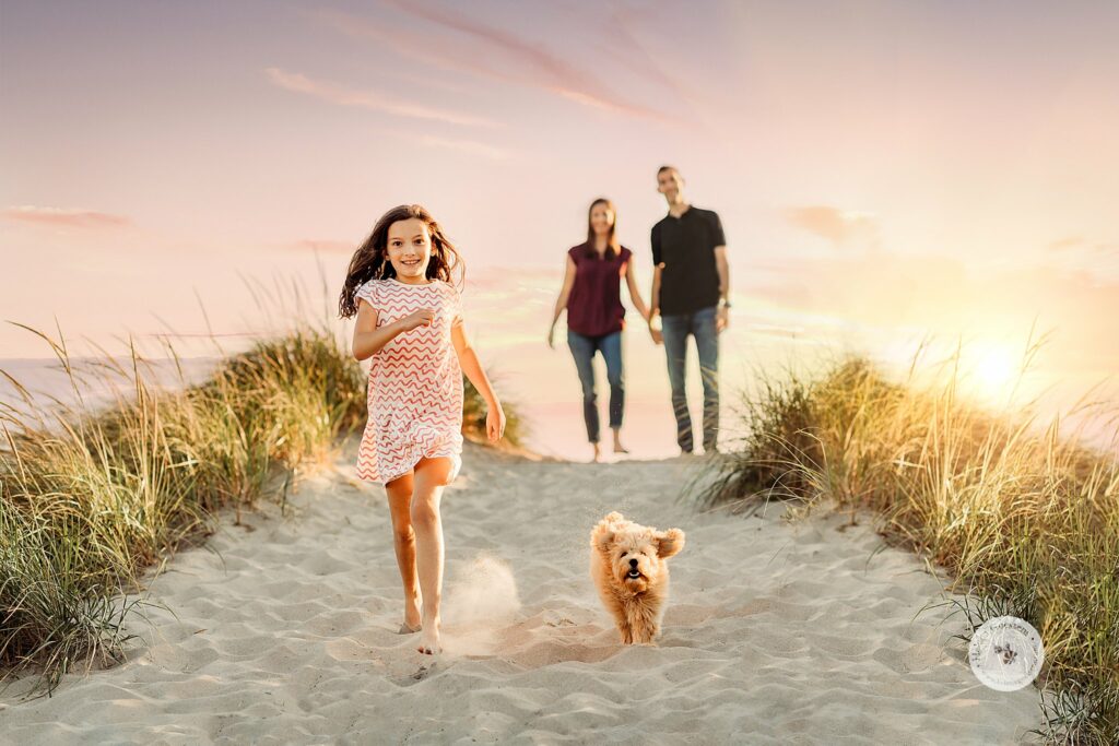 girl and dog run down hill during sunset Rexhame Beach family photos