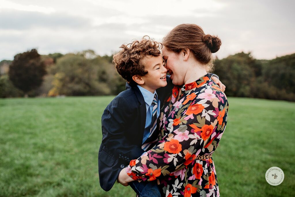 mom hugs son during MA family photos in the fall