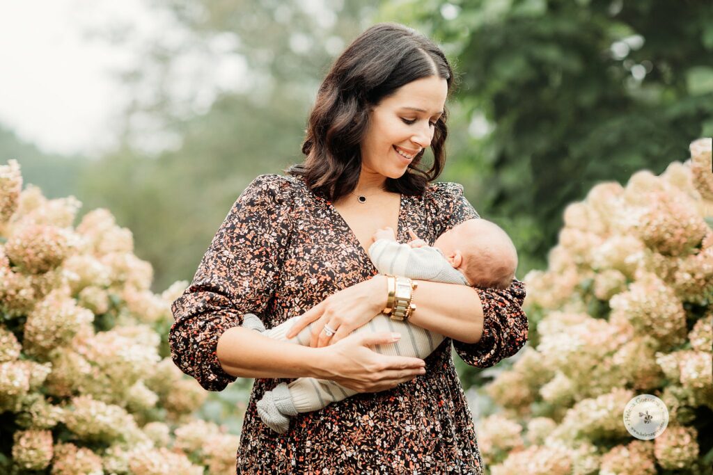 mom holds son during Fall Family Portraits at the Bradley Estate