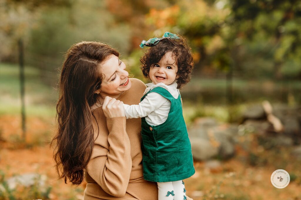 daughter hugs mom during fall family photos in Canton MA