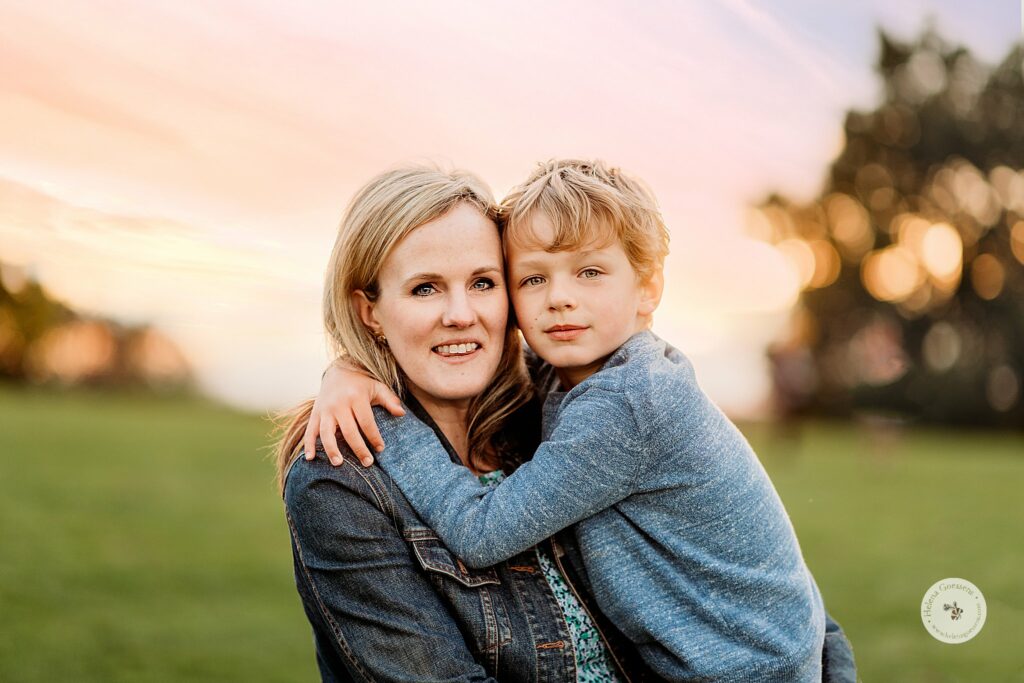 mom holds son during Sunset Family Portraits at Larz Anderson Park