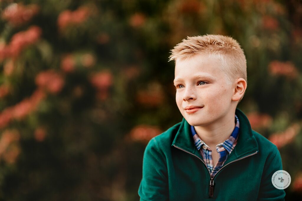 boy in green sweater looks off during Public Garden Family Portraits