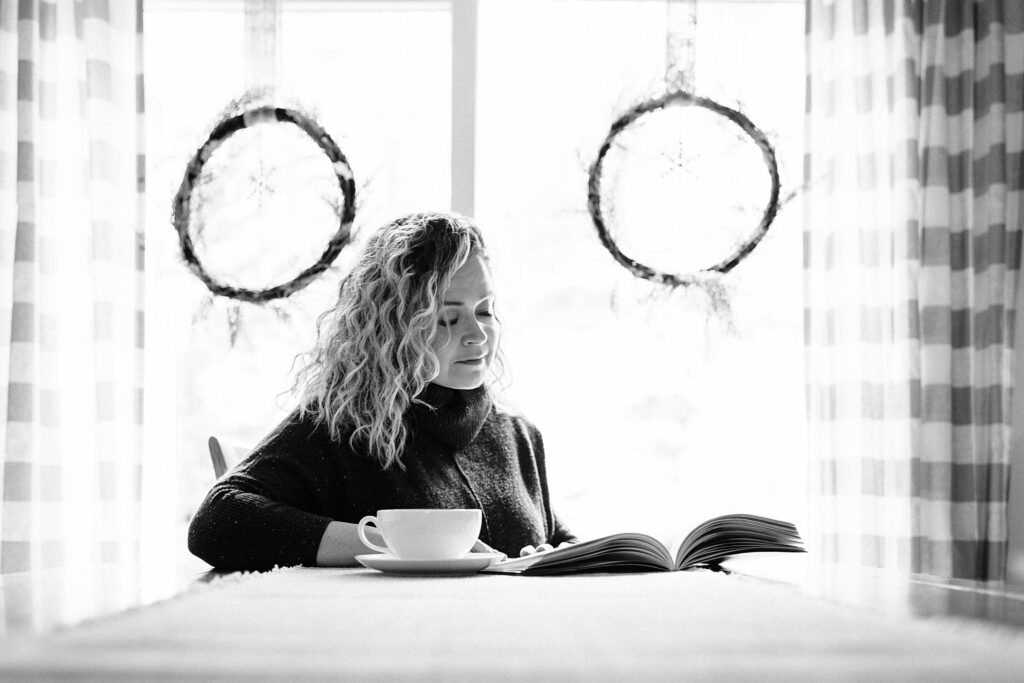woman reads during winter photographed by Boston family photographer 