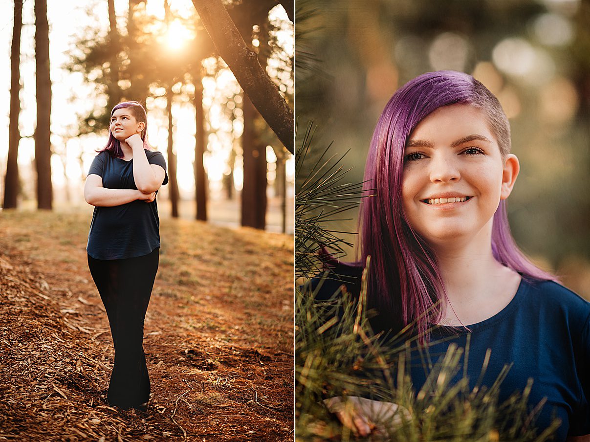 senior with purple hair poses in trees at Arnold's Arboretum