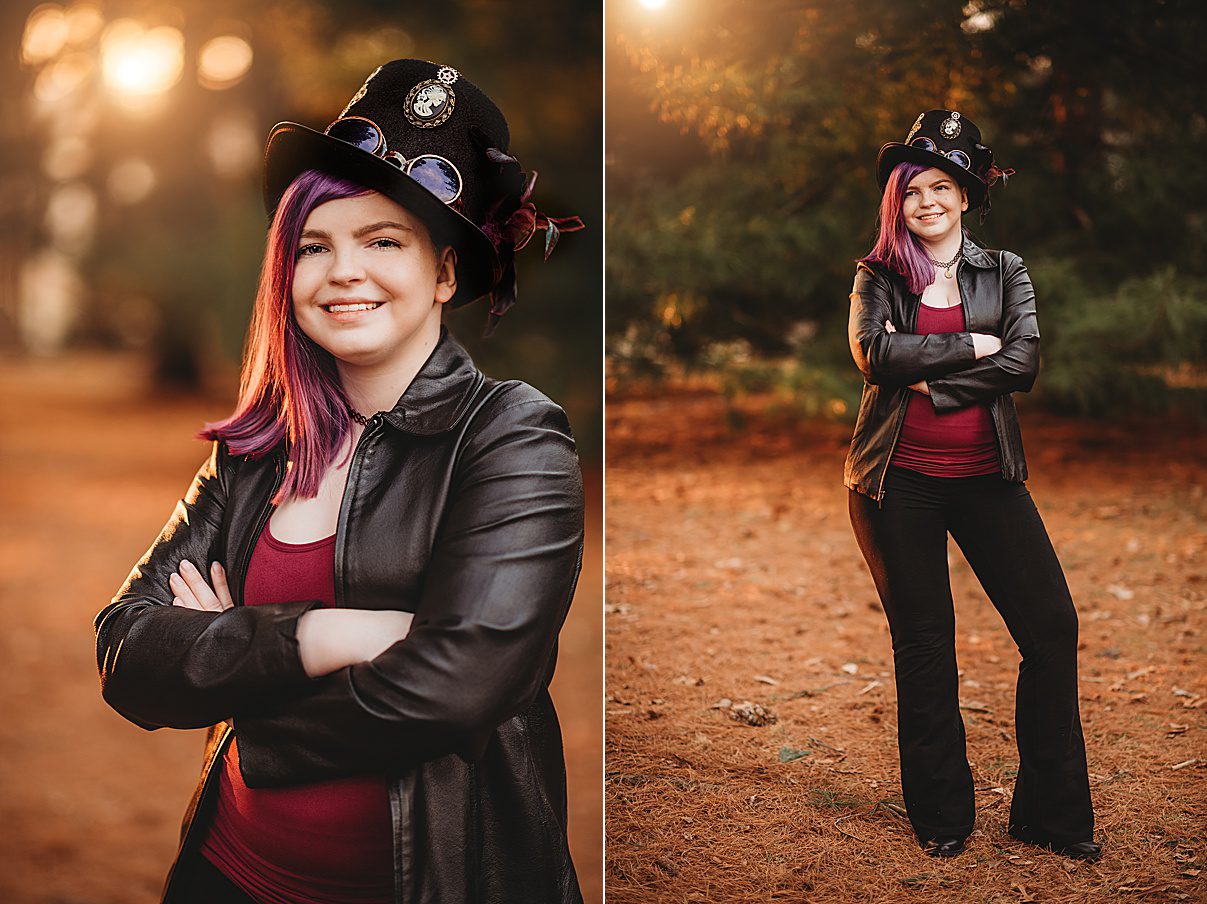 senior poses in leather jacket with custom hat during photos at Arnold's Arboretum